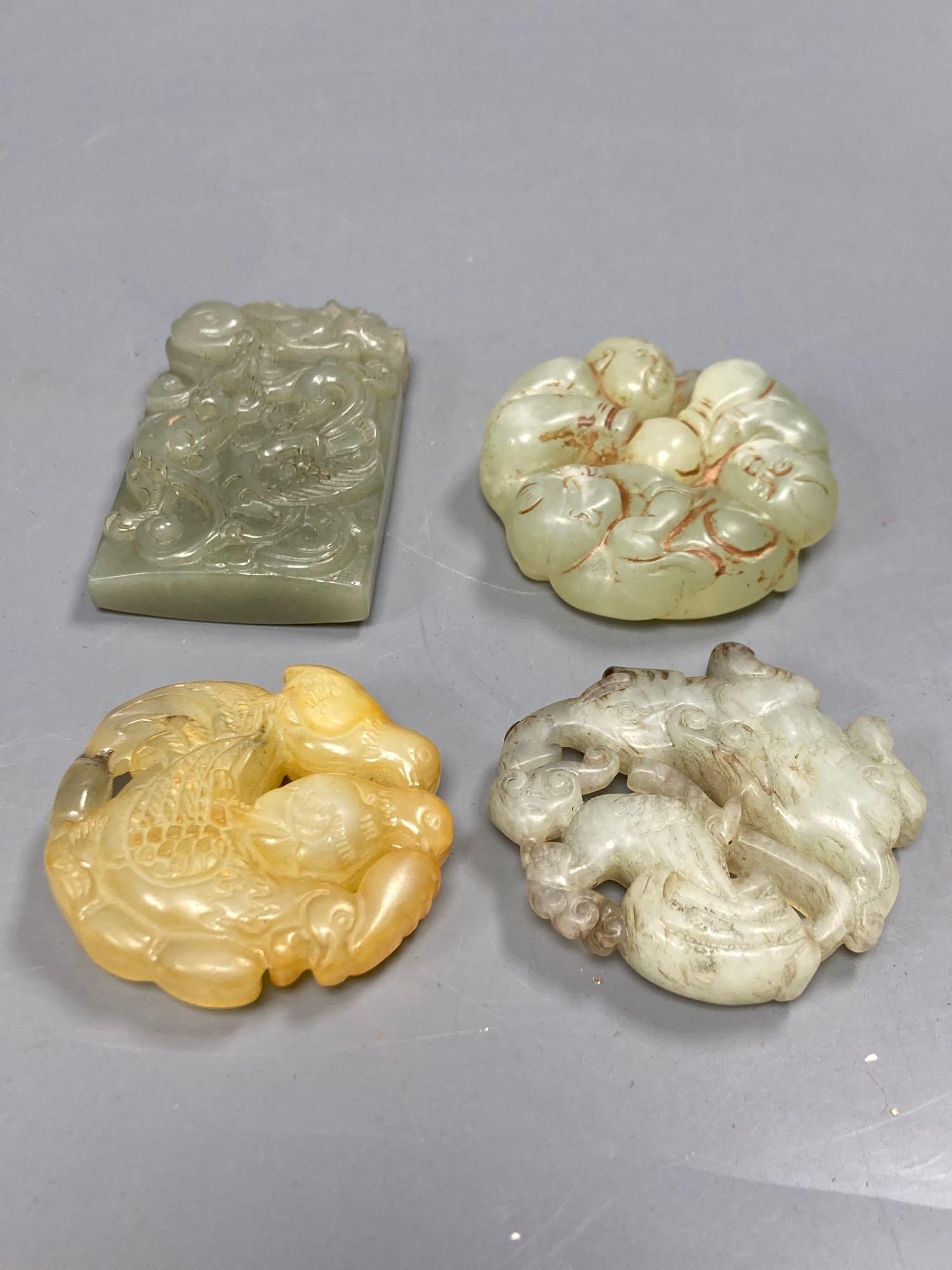 A group of four Chinese jade and hardstone carvings